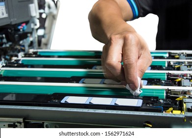 Technician Hand Cleaning Color Copier Drum In Overhaul Process On  Isolate Background