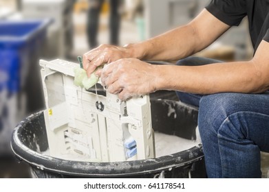 Technician Hand Cleaning Copier Body Part In Overhaul Process