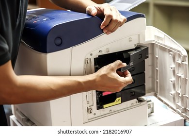 Technician Hand Open Cover Photocopier Or Photocopy To Fix Paper Jam And Replace Ink Cartridges For Scanning Fax Or Copy Document In Office Workplace.