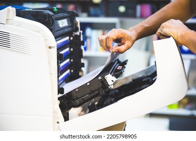 Technician Hand Open Cover Photocopier Or Photocopy To Fix Copier Paper Jam And Replace Ink Cartridges For Scanning Fax Or Copy Document In Office Workplace.