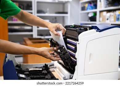 Technician Hand Open Cover Photocopier Or Photocopy To Fix Copier Paper Jam And Replace Ink Cartridges For Scanning Fax Or Copy Document In Office Workplace.