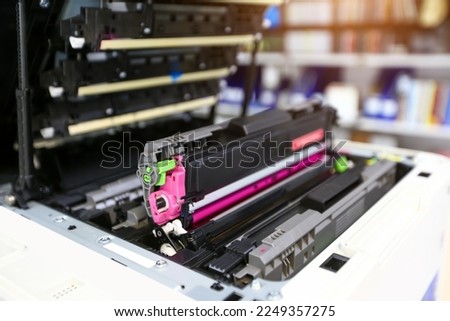 Technician hand open cover printer photocopier or photocopy to replace ink cartridges or fix paper jam for scanning fax or copy document in office workplace.