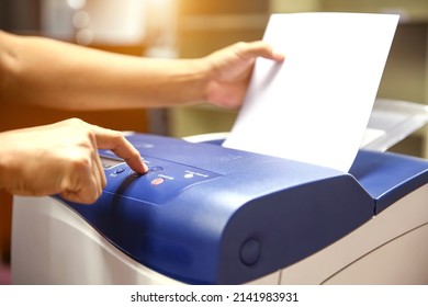 Technician Hand Press Button And Load Paper In Tray To Using Photocopier For Scanning Fax Or Photocopy Or Copy Document After Repairing Paper Jam Or Change Toner Cartridge In Office Workplace.