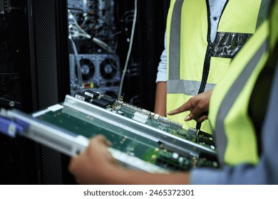 IT technician, hands and maintenance in server room for working, programming and installation of motherboard for data. People, engineer and technology for repair or fixing, hardware and configuration