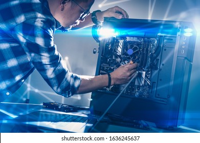 The Technician Hold The Screwdriver For Repairing The Computer. The Concept Of Computer Hardware, Repairing, Upgrade And Technology.