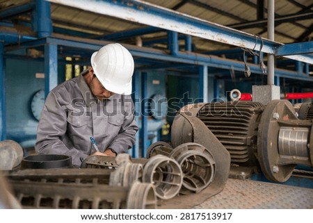 Technician Inspecting Pump Impeller During Routine Industrial Equipment Maintenance Process