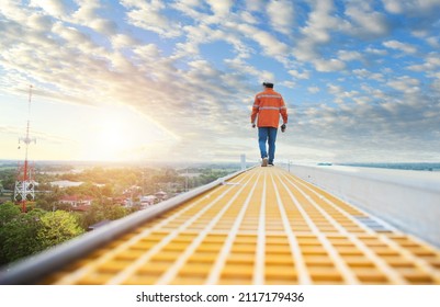 Technician Inspecting Solar Panel Maintenance On Hospital Roof, Solar Panel Maintenance View