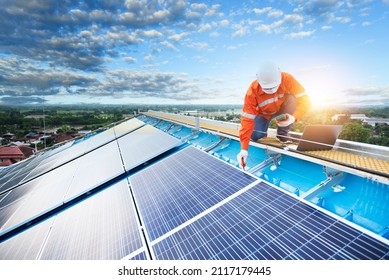 Technician Inspecting Solar Panel Maintenance On Hospital Roof, Solar Panel Maintenance View