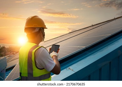 Technician Inspecting Solar Panel Maintenance On Hospital Roof, Solar Panel Maintenance View