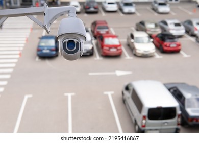 Technician Installed IP CCTV Camera Hi-technology For Look Security Area Of Work In Car Parking Lot Show Signage With Security Cars Park In Area.