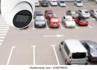 Technician Installed IP CCTV Camera Hi-technology For Look Security Area Of Work In Car Parking Lot Show Signage With Security Cars Park In Area.