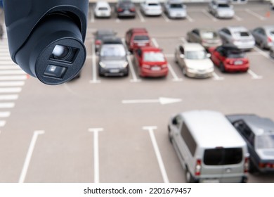 Technician Installed IP CCTV Camera Hi-technology For Look Security Area Of Work In Car Parking Lot Show Signage With Security Cars Park In Area.