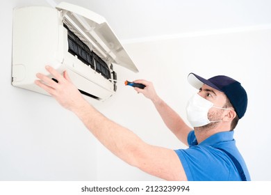 Technician Installing Air Conditioner On The Wall At Home For Hvac Service