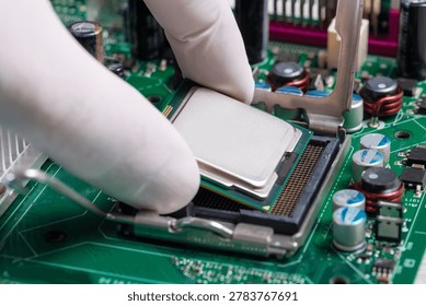 Technician Installing CPU Processor Into Motherboard Socket During Desktop Computer Hardware Upgrade