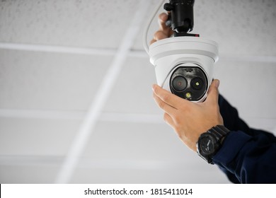 Technician installing IP wireless CCTV camera by screwed for home security system and installed 