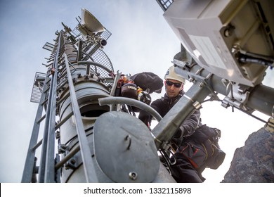 Technician is installing new antennas for fast internet