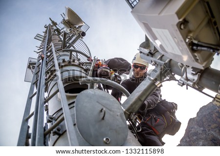 Technician is installing new antennas for fast internet