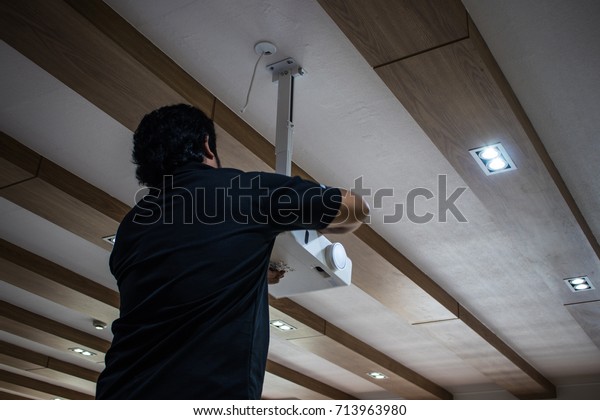 Technician Installing Testing New Projector On Stock Photo