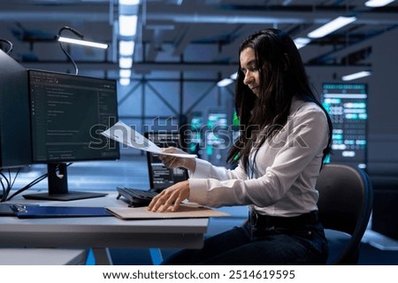 Technician maintaining accurate documentation of data center equipment, configurations, and procedures. Woman in server hub establishing performance benchmarks and conducting analysis
