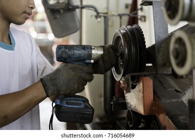 Technician Maintenance Of Agricultural Machinery Working In The Factory.