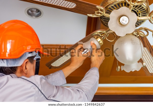 Technician Man Hand Changing Lightbulb Ceiling Stock Photo Edit