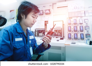 Technician man monitoring petrochemical plant in center control room, Control industrial plant with talki-walki communication - Powered by Shutterstock