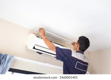 Technician man service for cleaning air conditioner, Repairman washing dirty compartments air conditioning, Maintenance and service concepts