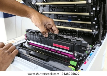 Technician open cover printer fix repair problem and replace drum and ink cartridges and for print scanning fax or copy document or photocopier or photocopy in office workplace service support concept