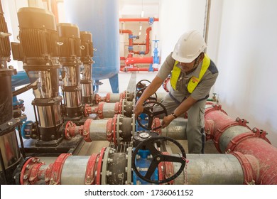 Technician Operation Fire Control System Valve High Pressure Water Pump For The Industrial Fire Pump System At Water Tank Station In Factory