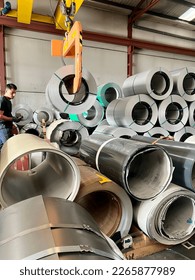 Technician order Rolls of galvanized steel sheet inside the factory or warehouse. - Shutterstock ID 2265877989