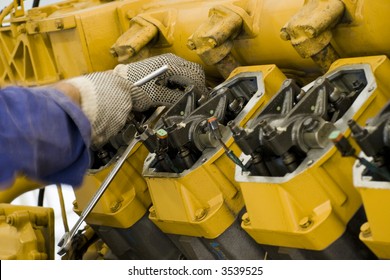 A Technician Performing Periodic Engine Maintenance In A Landfill Gas Recovery Plant