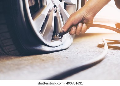 Technician Is Repairing Car Flat Tire