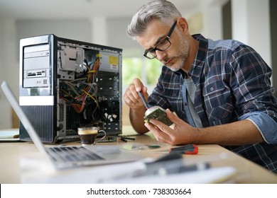 Technician Repairing Computer Hardware