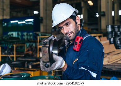 The Technician Repairing And Inspecting The Big Diesel Engine In The Train Garage