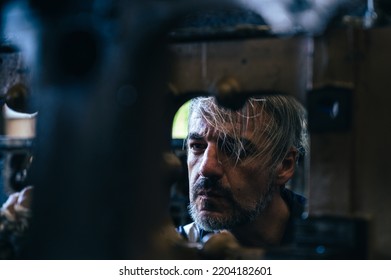 The Technician Repairing And Inspecting The Big Diesel Engine In The Train Garage