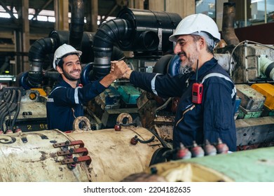 The Technician Repairing And Inspecting The Big Diesel Engine In The Train Garage