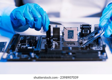 The technician repairing the motherboard in the lab with copy space. the concept of computer hardware, mobile phone, electronic, repairing, upgrade blue effect
 - Powered by Shutterstock