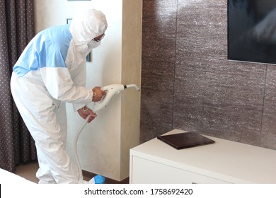 A Technician Is Sanitizing An Hotel Room In Prague, Using Steam And Ozone,  After The Coronavirus SARS-CoV-2 COVID-19 Pandemic