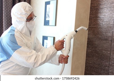 A Technician Is Sanitizing An Hotel Room In Prague, Using Steam And Ozone,  After The Coronavirus SARS-CoV-2 COVID-19 Pandemic