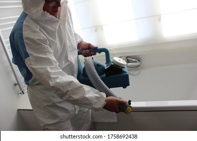 A Technician Is Sanitizing An Hotel Room In Prague, Using Steam And Ozone,  After The Coronavirus SARS-CoV-2 COVID-19 Pandemic