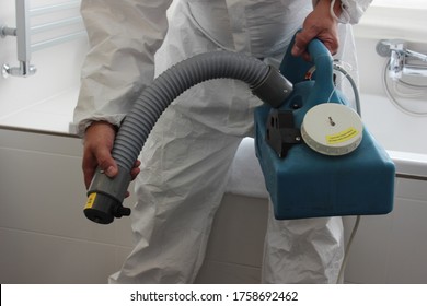 A Technician Is Sanitizing An Hotel Room In Prague, Using Steam And Ozone,  After The Coronavirus SARS-CoV-2 COVID-19 Pandemic