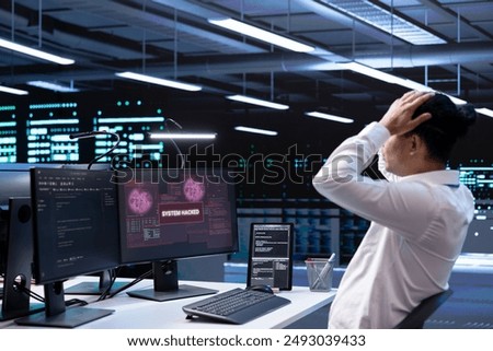 Technician in server hub doing face palm gesture, trying to protect hardware from hacker stealing information. Close up of data center employee stressed by security breach alert caused by virus
