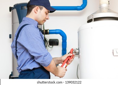 Technician servicing an hot-water heater 
