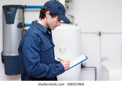 Technician servicing an hot-water heater