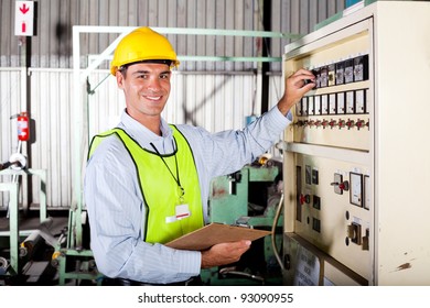 technician setting up industrial machine - Powered by Shutterstock