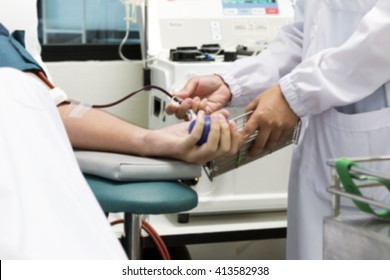 Technician Take A Blood Sample To Test The Protein Levels ,in Blood Plasma Donation Process, Blurred Background