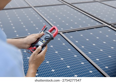 Technician testing solar panel system using multimeter supporting renewable energy maintenance and electrical inspection in photovoltaic power infrastructure