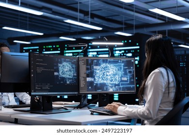 Technician using computer to do checkup in server room providing vast computing resources and storage, enabling artificial intelligence to process massive datasets for training and inference