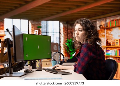 Technician using isolated screen computer to do maintenance on artificial intelligence neural networks. Woman in tech startup office using AI systems on chroma key PC display