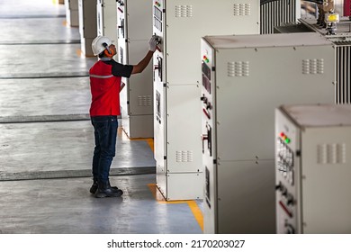 A Technician Using Safety Equipment Is Performing Maintenance On A Diesel Engine At A Power Plant At A Private Power Plant In Bangka Belitung.  April 15th 2015